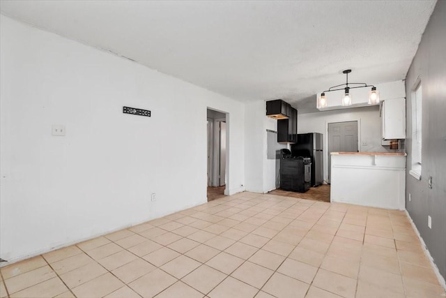 6201 Batterson St, Houston, TX 77026 - unfurnished living room featuring light tile patterned flooring