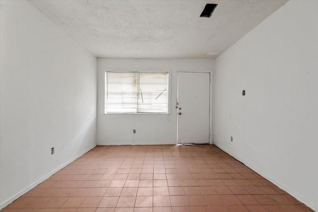 6201 Batterson St, Houston, TX 77026 - spare room featuring a textured ceiling
