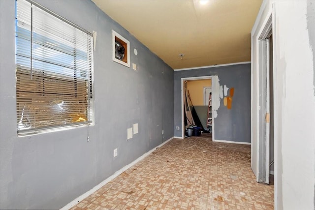 6201 Batterson St, Houston, TX 77026 - corridor with baseboards and brick patterned floor