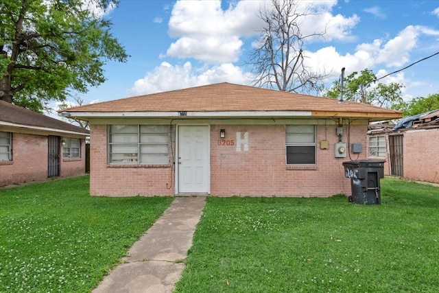 6201 Batterson St, Houston, TX 77026 - rear view of property with a yard and brick siding