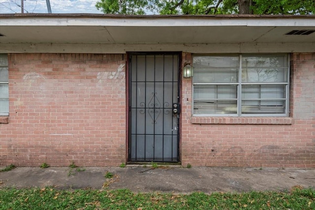 6201 Batterson St, Houston, TX 77026 - property entrance featuring brick siding