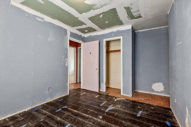 6201 Batterson St, Houston, TX 77026 - unfurnished bedroom featuring wood-type flooring and a closet