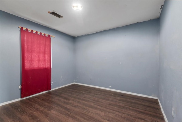 6201 Batterson St, Houston, TX 77026 - empty room featuring baseboards and wood finished floors
