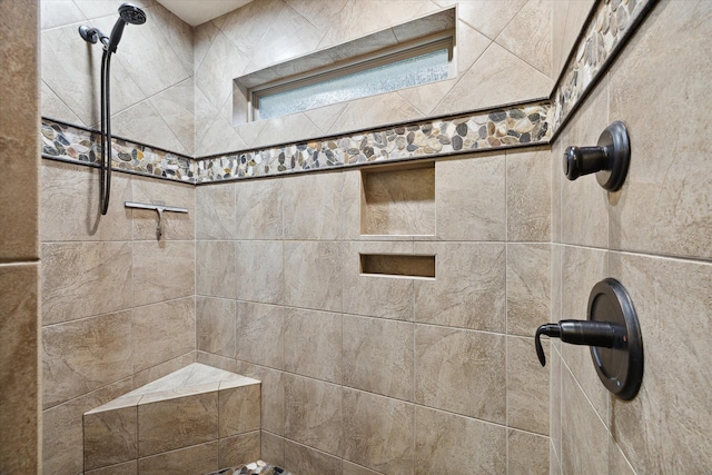 full bathroom featuring a tile shower