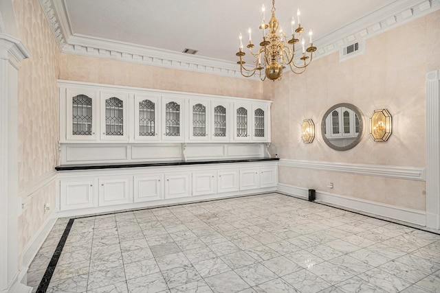 interior space featuring an inviting chandelier, crown molding, marble finish floor, and visible vents