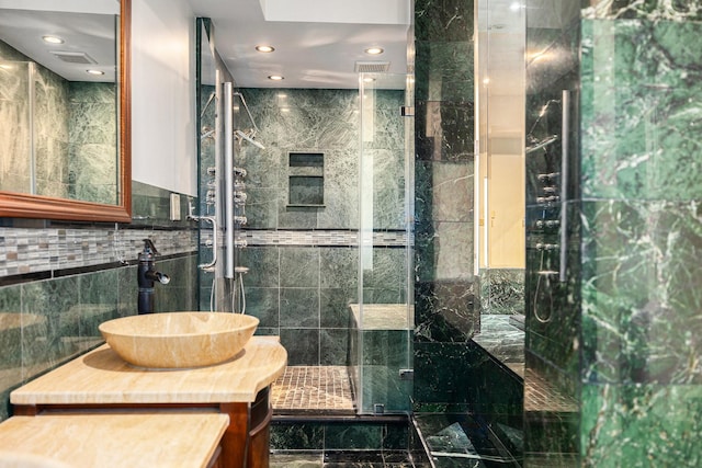 7415 Naremore Dr, Spring, TX 77379 - full bath featuring vanity, a stall shower, tile walls, and visible vents