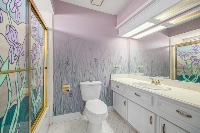 bathroom featuring vanity, tile patterned flooring, baseboards, and toilet