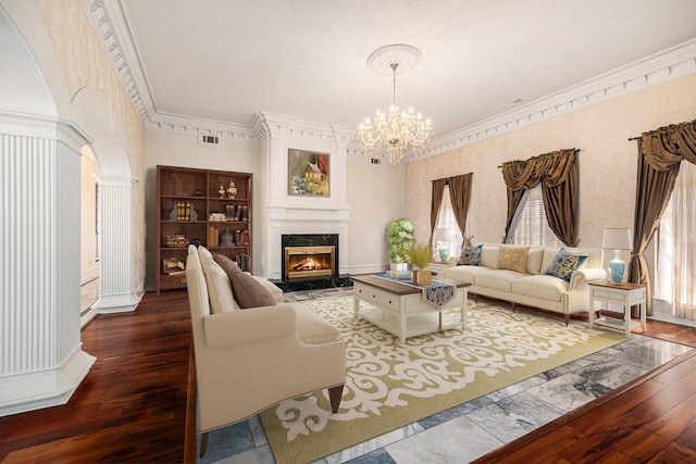 7415 Naremore Dr, Spring, TX 77379 - living room with visible vents, ornamental molding, an inviting chandelier, wood finished floors, and a premium fireplace