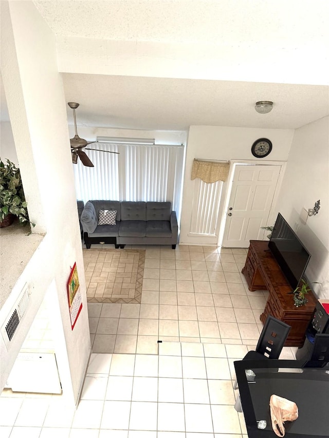 12606 Newbrook Dr, Houston, TX 77072 - living area with ceiling fan and light tile patterned flooring