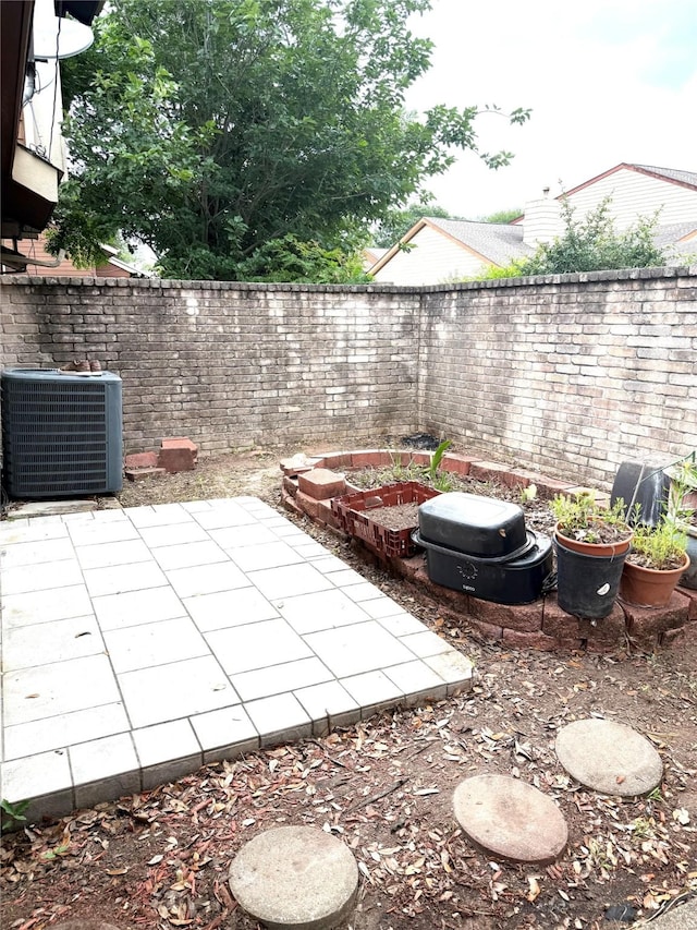 12606 Newbrook Dr, Houston, TX 77072 - view of yard with a fenced backyard, central AC unit, and a patio area