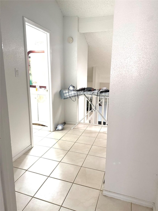 12606 Newbrook Dr, Houston, TX 77072 - corridor with a textured ceiling and light tile patterned floors