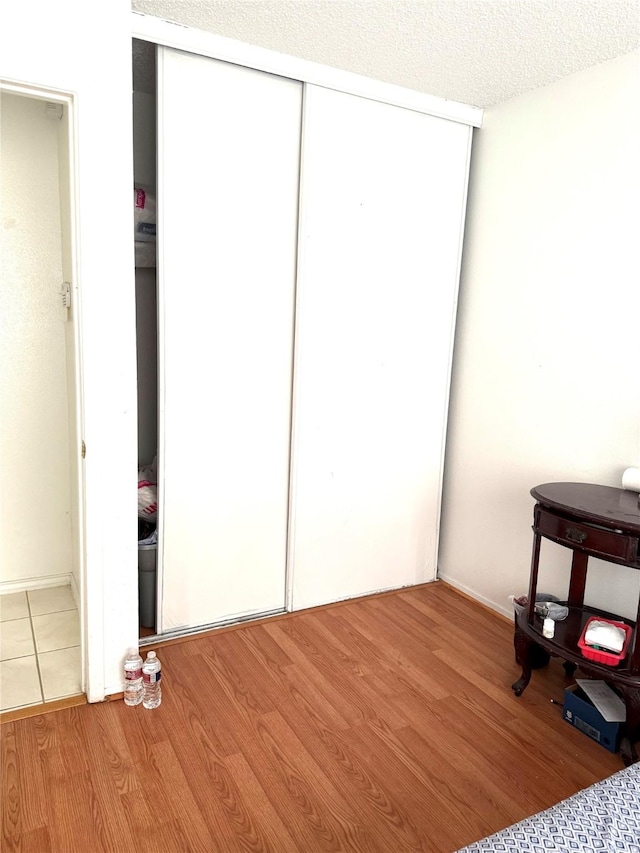 12606 Newbrook Dr, Houston, TX 77072 - bedroom with light wood finished floors and a closet