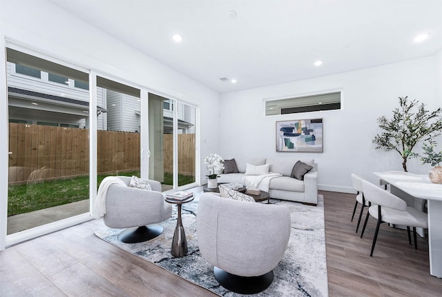 3515 Mcilhenny St, Houston, TX 77004 - living room with baseboards, recessed lighting, and wood finished floors