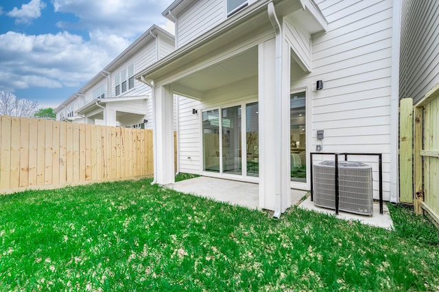 3515 Mcilhenny St, Houston, TX 77004 - rear view of house featuring fence, a yard, central AC, and a patio area