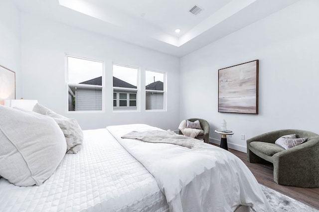 3515 Mcilhenny St, Houston, TX 77004 - bedroom with a raised ceiling, recessed lighting, baseboards, wood finished floors, and visible vents