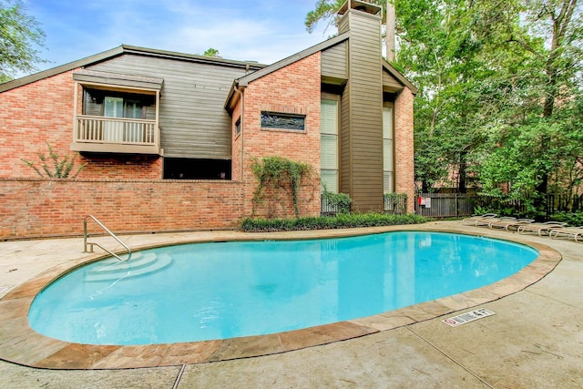 214 Sugarberry Cir, Houston, TX 77024 - pool with a patio area and fence