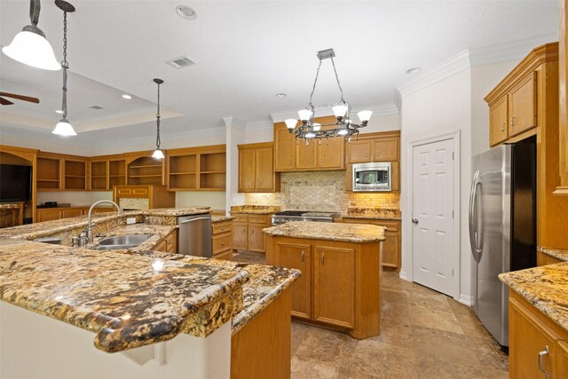 kitchen featuring ornamental molding, a large island, tasteful backsplash, a sink, and appliances with stainless steel finishes