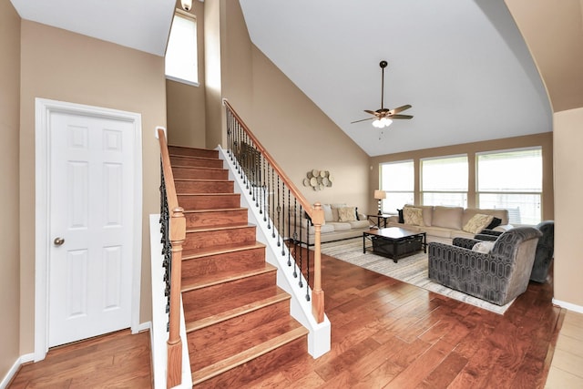 7603 Chimney Gap, Missouri City, TX 77459 - stairway featuring baseboards, a ceiling fan, wood finished floors, and high vaulted ceiling