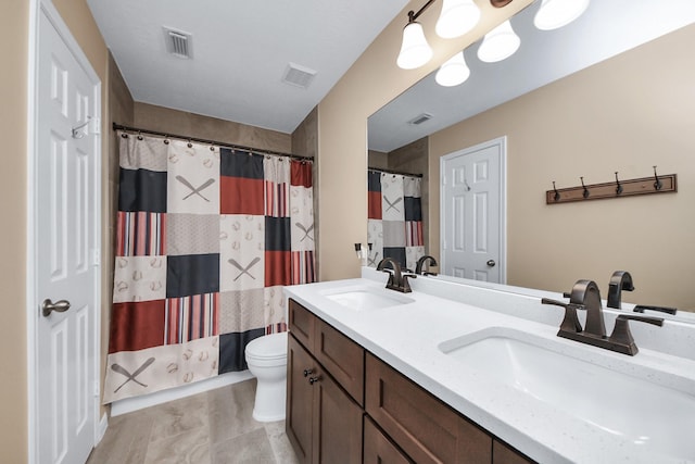 7603 Chimney Gap, Missouri City, TX 77459 - full bathroom with a sink, toilet, and visible vents