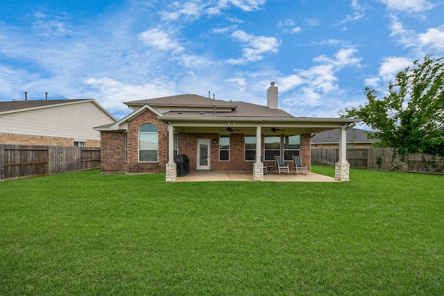 7603 Chimney Gap, Missouri City, TX 77459 - back of property featuring a ceiling fan, roof with shingles, a fenced backyard, and a yard