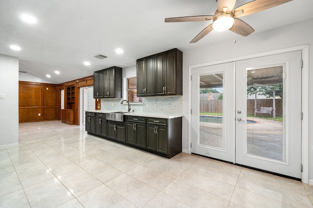 kitchen featuring a ceiling fan, french doors, visible vents, light countertops, and a sink