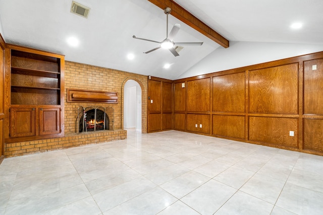 unfurnished living room featuring visible vents, a fireplace, vaulted ceiling with beams, arched walkways, and a ceiling fan