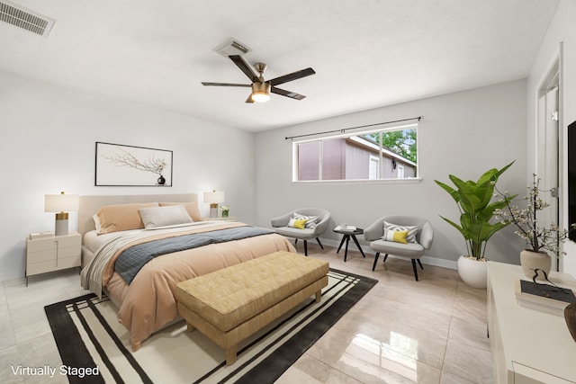 bedroom featuring visible vents, ceiling fan, and light tile patterned floors