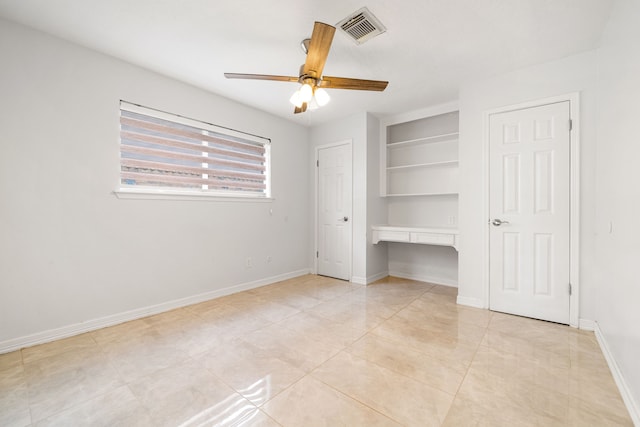 unfurnished bedroom with visible vents, baseboards, ceiling fan, and light tile patterned floors