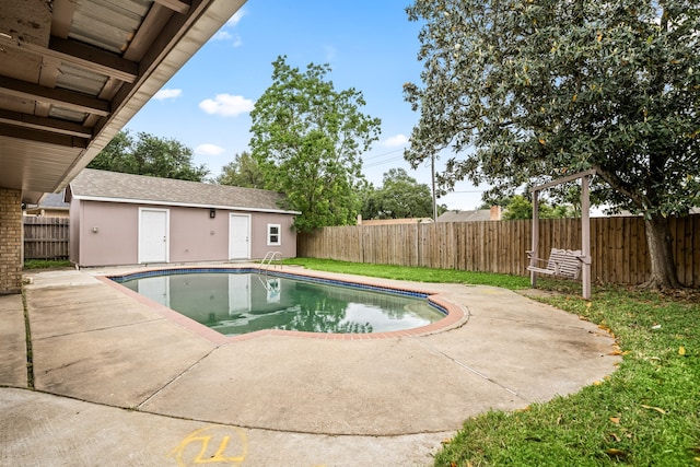 view of swimming pool featuring a fenced in pool, a fenced backyard, and a patio area