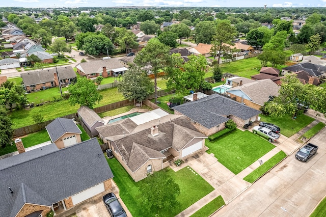 birds eye view of property with a residential view