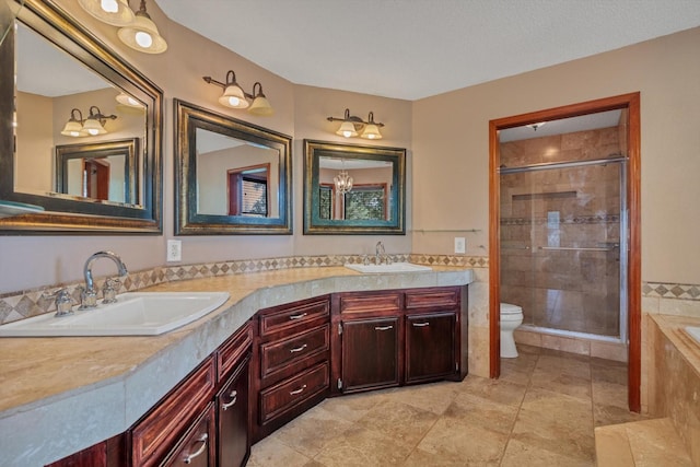 7739 County Road 684, Sweeny, TX 77480 - full bathroom with double vanity, a sink, toilet, and tiled shower