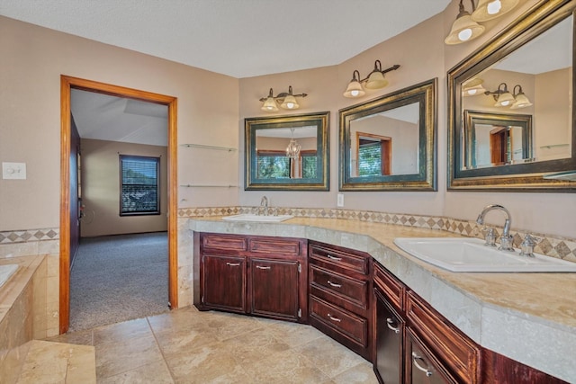 7739 County Road 684, Sweeny, TX 77480 - full bathroom with a sink, tile patterned floors, double vanity, and a relaxing tiled tub