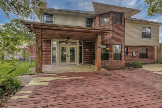 7739 County Road 684, Sweeny, TX 77480 - rear view of house featuring french doors, a wooden deck, central air condition unit, brick siding, and fence