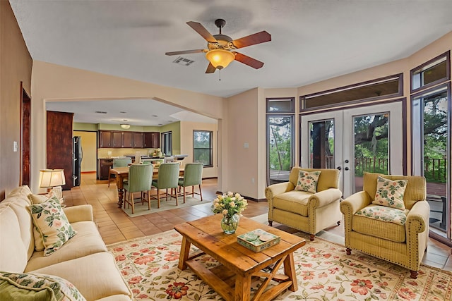 7739 County Road 684, Sweeny, TX 77480 - living area featuring french doors, light tile patterned flooring, and ceiling fan