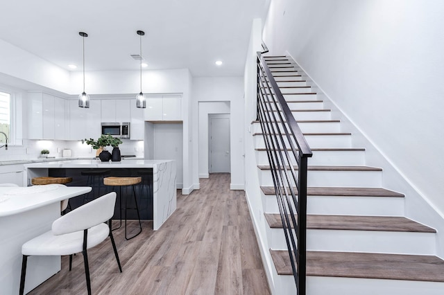 interior space featuring recessed lighting, wood finished floors, and visible vents