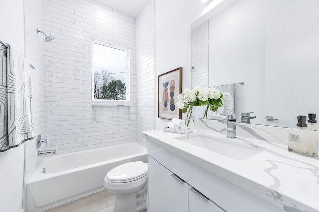 bathroom with toilet, washtub / shower combination, and vanity