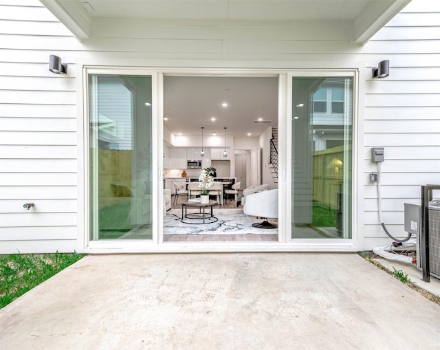 doorway to property with a patio area