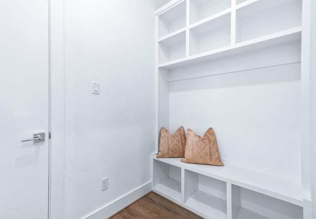 mudroom with dark wood-type flooring and baseboards