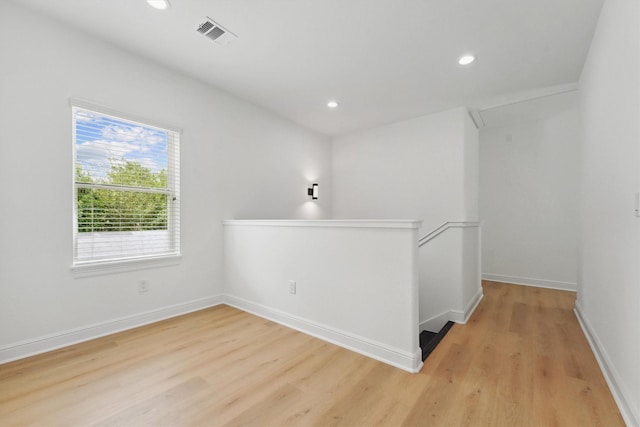 5013 Golden Forest Dr, Houston, TX 77091 - unfurnished room with light wood finished floors, recessed lighting, baseboards, and attic access