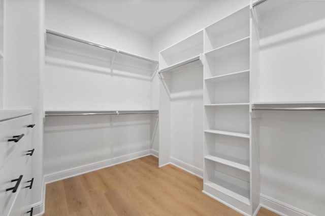 5013 Golden Forest Dr, Houston, TX 77091 - walk in closet with wood finished floors