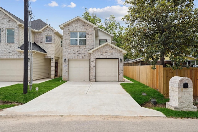 5013 Golden Forest Dr, Houston, TX 77091 - view of front of house featuring driveway, brick siding, and a garage