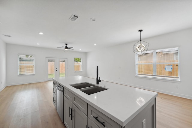5013 Golden Forest Dr, Houston, TX 77091 - kitchen featuring a sink, light wood-type flooring, stainless steel dishwasher, a ceiling fan, and recessed lighting