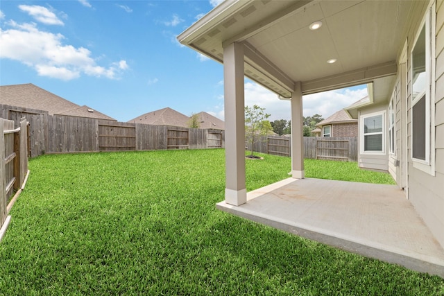 view of yard featuring a fenced backyard and a patio area