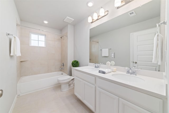bathroom featuring a sink, toilet, double vanity, and visible vents