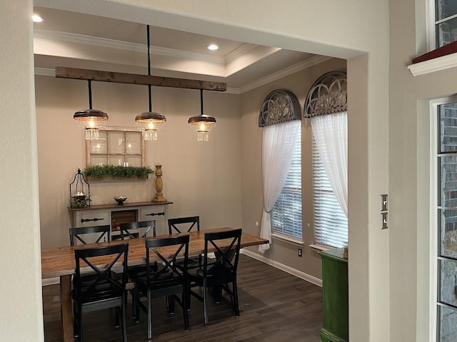 dining room featuring ornamental molding, baseboards, dark wood-style floors, recessed lighting, and a raised ceiling