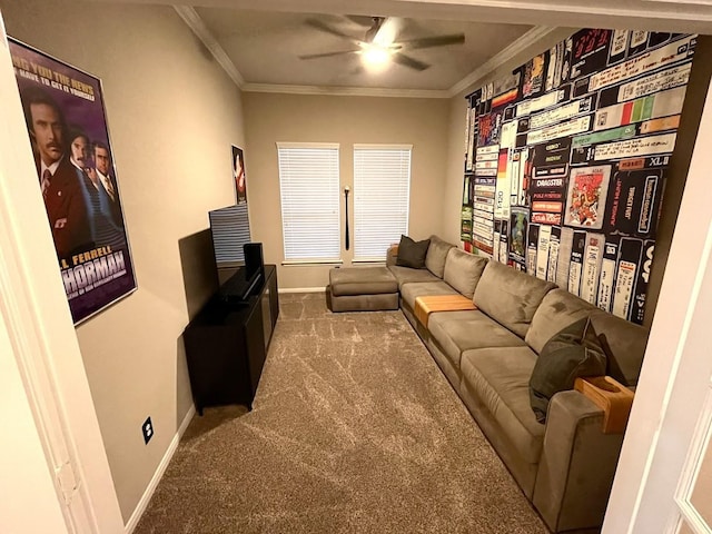 living room with crown molding, carpet floors, baseboards, and a ceiling fan