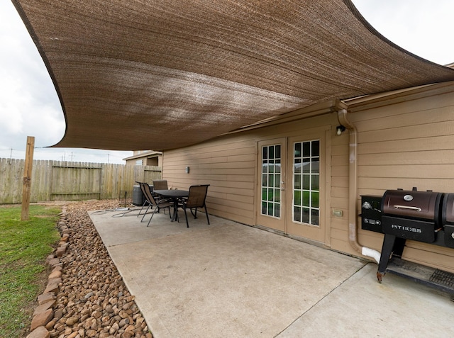 view of patio featuring fence and outdoor dining space