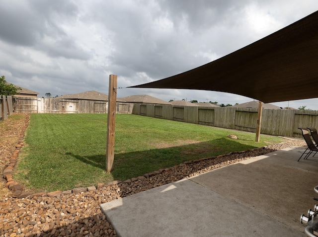 view of yard with a fenced backyard and a patio area