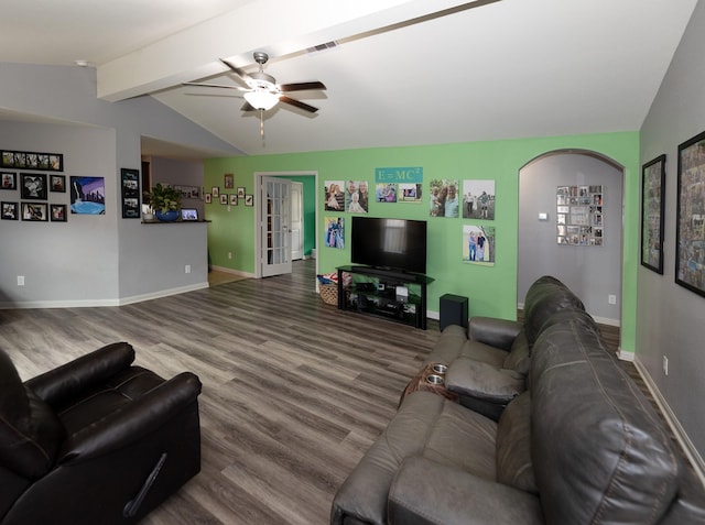 living room with baseboards, visible vents, lofted ceiling with beams, and wood finished floors