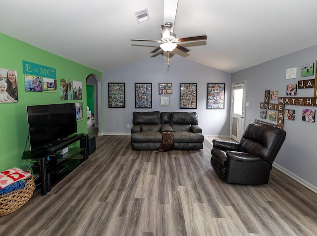 living area with a ceiling fan, visible vents, wood finished floors, baseboards, and lofted ceiling